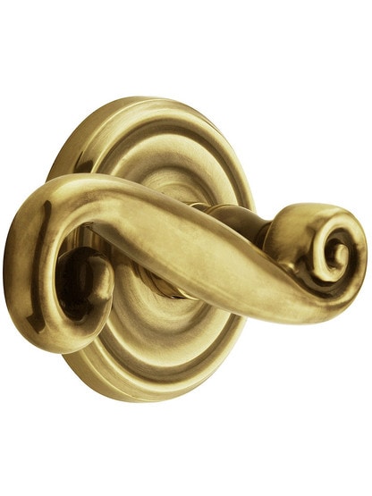 Classic Rosette Set With Rustic Levers Left Hand in Antique Brass.